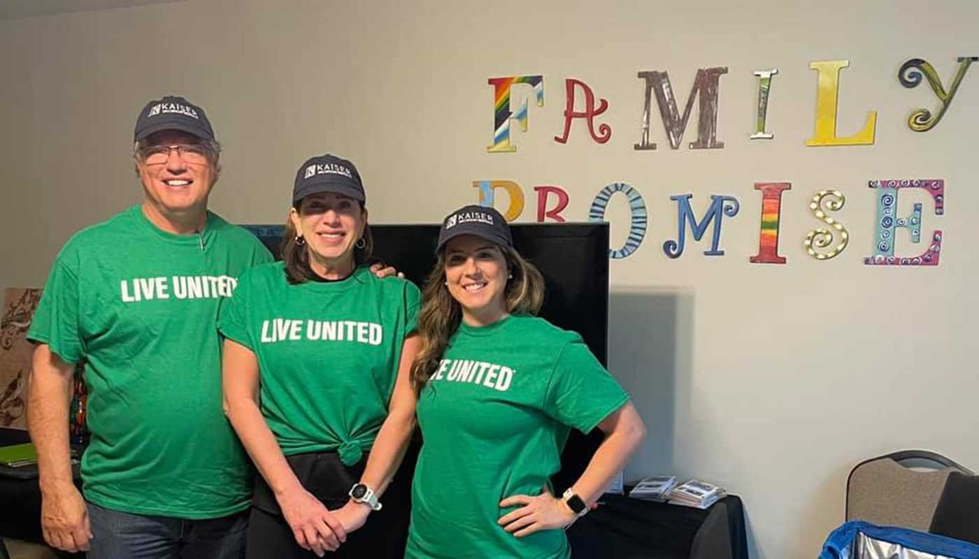 kaiser vacation rentals team members in matching shirts and hats preparing for united way day of caring