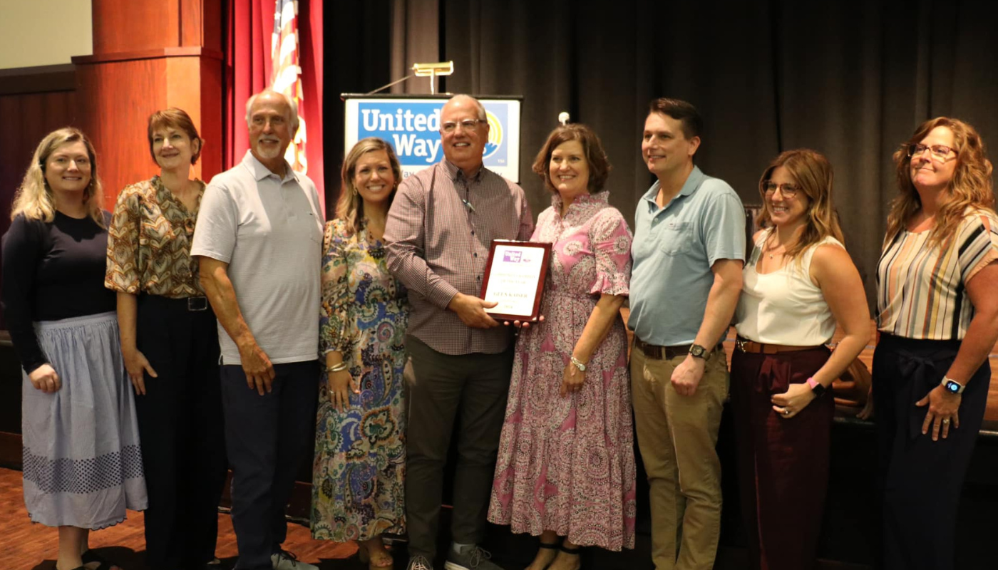 the kaiser vacation rentals team accepting an award